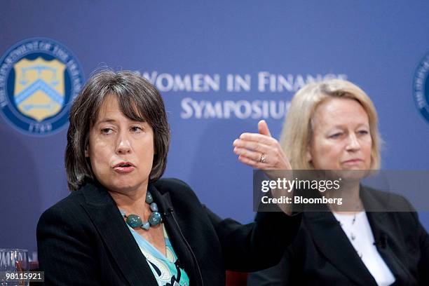 Sheila Bair, chairman of the U.S. Federal Deposit Insurance Corp., left, speaks during the Women in Finance Symposium with Mary Schapiro, chairman of...