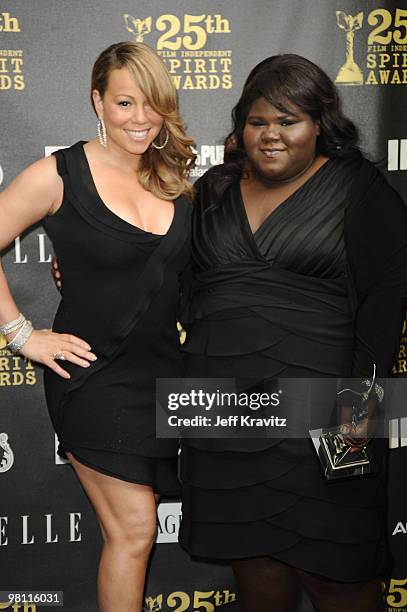 Actress Gabourey Sidibe poses with Mariah Carey in the press room at the 25th Film Independent Spirit Awards held at Nokia Theatre LA Live on March...