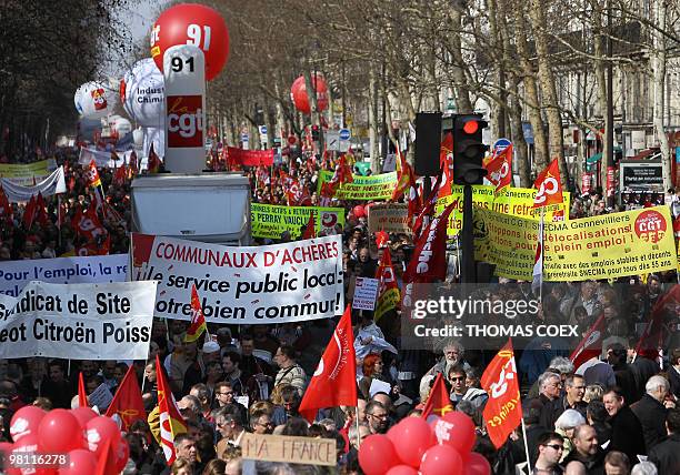 Several thousands people demonstrate on March 23, 2010 in Paris, as part of a nationwide day of protest against job cuts, wages, the high cost of...