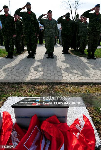 Canadian soldiers, members of the NATO mission in Bosnia and Herzegovina stand to attention for the unveiling of memorial plaque during the Canadian...