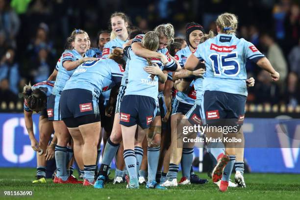 The Blues celebrate victory during the Women's State of Origin match between New South Wales and Queensland at North Sydney Oval on June 22, 2018 in...