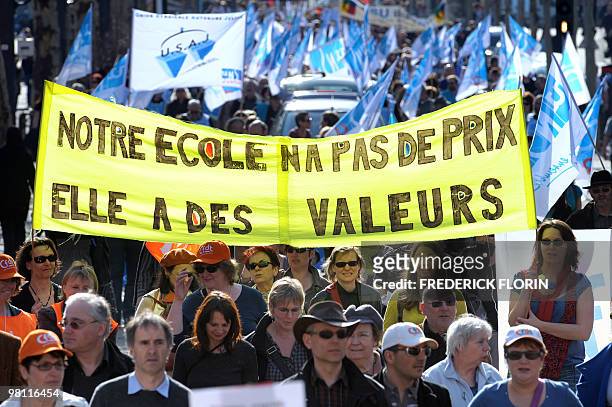 People demonstrate on March 23, 2010 in Strasbourg, as part of a nationwide day of protest against job cuts, wages, the high cost of living and plans...
