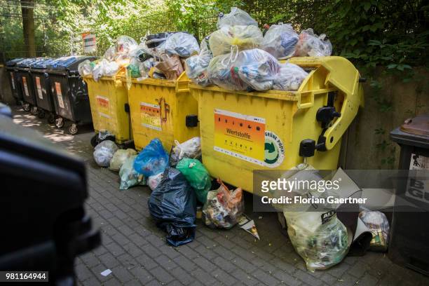 Overfilled dumpsters are pictured on June 08, 2018 in Berlin, Germany.