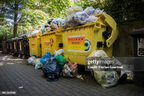 Overfilled dumpsters are pictured on June 08, 2018 in Berlin, Germany.