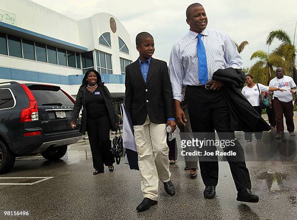 Democratic Senate candidate Kendrick Meek walks with his son Kendrick Meek Jr. After delivering a box of voter petitions to the Miami-Dade Supervisor...