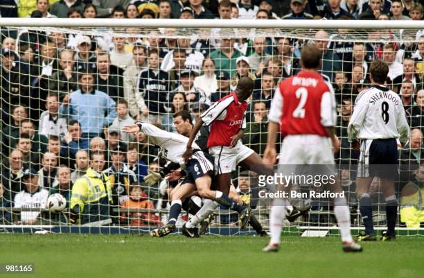 Patrick Vieira scores Arsenals first goal during the AXA FA Cup Semi-Final between Arsenal and Tottenham Hotspur at Old Trafford, Manchester....