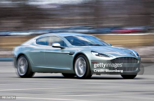 The four door Aston Martin Rapide sedan is driven in Bear Mountain State Park in Bear Mountain, New York, U.S., on Tuesday, March 9, 2010. The...