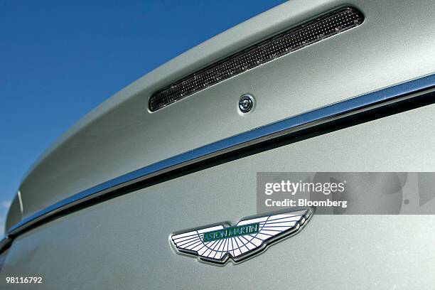 The emblem of the four door Aston Martin Rapide sedan is photographed in Bear Mountain State Park in Bear Mountain, New York, U.S., on Tuesday, March...