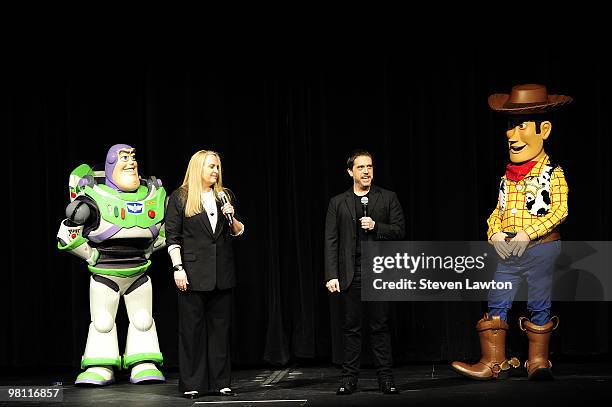 Buzz Lightyear" character, producer Darla K. Anderson, director Lee Unkrich and a "Woody" character speak onstage to introduce a screening of the...