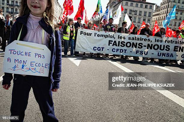 People demonstrate on March 23, 2010 in Lyon, as part of a nationwide day of protest against job cuts, wages, the high cost of living and plans for...