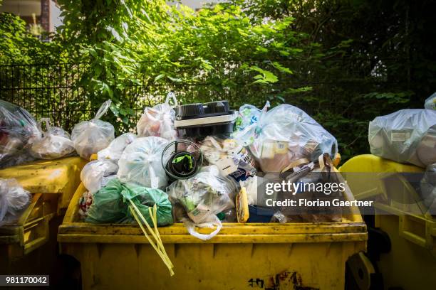 Overfilled dumpsters are pictured on June 08, 2018 in Berlin, Germany.