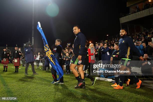 Ash Dixon and Lima Sopoaga of the Highlanders lead the team out on to the field ahead of the match between the Highlanders and the French Barbarians...