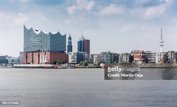 port of hamburg with elbphilharmonie - skyline stock-fotos und bilder