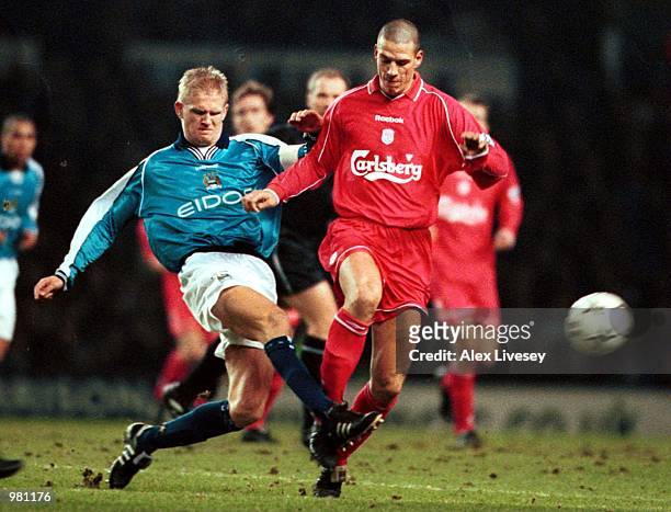 Alf Inge Haaland of Man City clears from Christian Ziege of Liverpool during the match between Manchester City v Liverpool in the FA Carling...