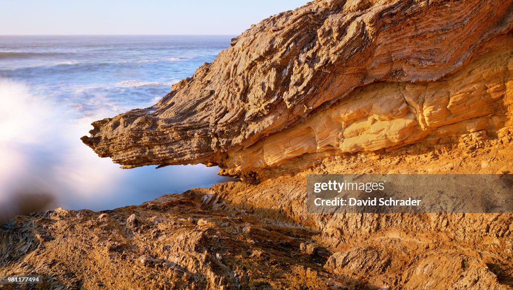 Wave splashing on rock, California, USA