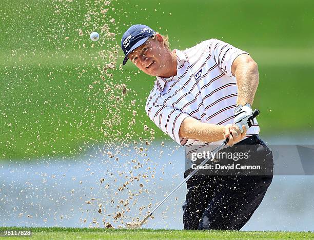 Ernie Els of South Africa plays a bunker shot on the 17th hole during the completion of the final round of the Arnold Palmer Invitational presented...