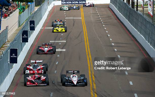 Will Power driver of the Verizon Team Penske Dallara Honda leads a pack of cars as Scott Dixon driver of the Target Chip Ganassi Dallara Honda drives...