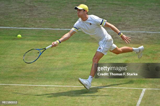 Matthew Ebden of Australia plays a forehand in his match against Roger Federer of Switzerland during day five of the Gerry Weber Open at Gerry Weber...