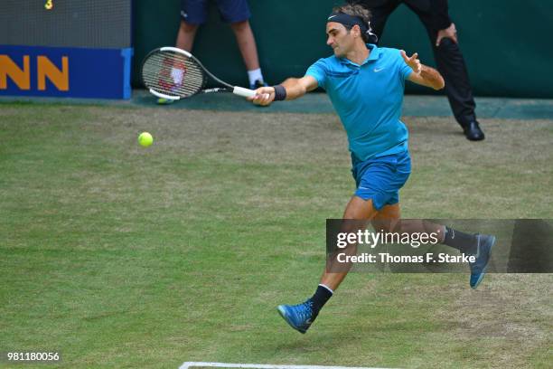 Roger Federer of Switzerland plays a forehand in his match against Matthew Ebden of Australia during day five of the Gerry Weber Open at Gerry Weber...