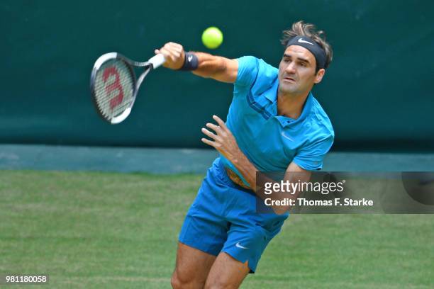 Roger Federer of Switzerland serves in his match against Matthew Ebden of Australia during day five of the Gerry Weber Open at Gerry Weber Stadium on...