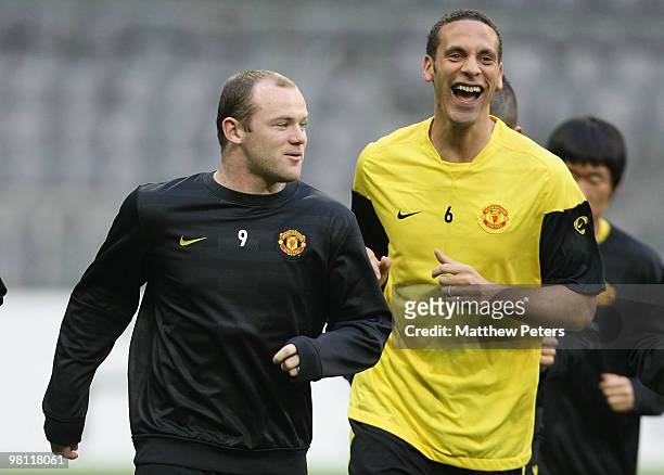 Rio Ferdinand and Wayne Rooney of Manchester United in action during a First Team Training Session ahead of their UEFA Champions League Quarter-Final...