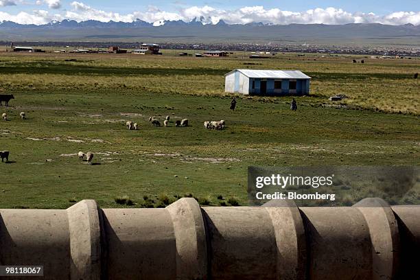 Pipe carries water treated at the state-owned Empresa Publica Social del Agua y Saneamiento SA Puchuckollo treatment facility in Viacha, Bolivia, on...