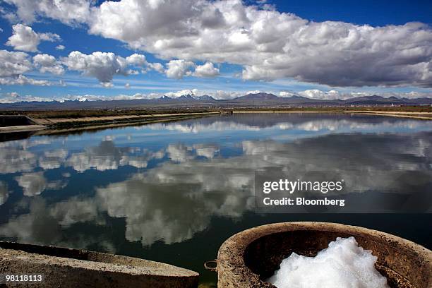 Water sits in a reservoir after being treated at the state-owned Empresa Publica Social del Agua y Saneamiento SA Puchuckollo treatment facility in...