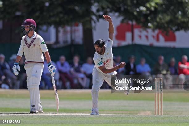 Ryan Patel of Surrey bowls as Lewis Gregory of Somerset looks on during day 3 of the Specsavers County Championship Division One match between Surrey...