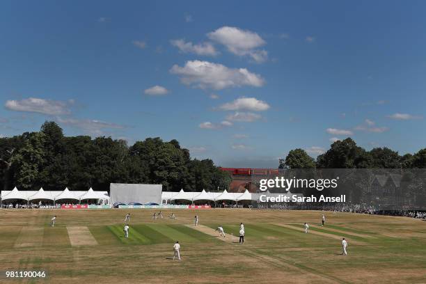 General view of play as a train passes across the bridge at the Railway End of the ground on day 3 of the Specsavers County Championship Division One...