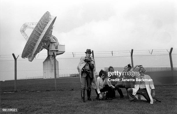 Members of the British rock group Hawklords pose together outside the GCHQ Composite Signals Organisation Station, Morwenstow, England, 1978....