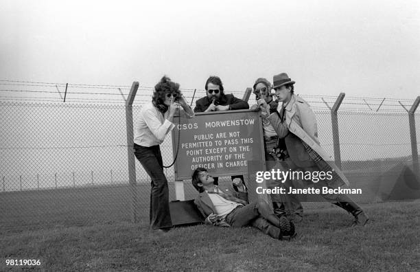 Members of the British rock group Hawklords pose together outside the GCHQ Composite Signals Organisation Station , Morwenstow, England, 1978....