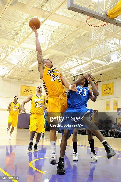 Diamon Simpson of the Los Angeles D-Fenders goes up for a shot over Larry Owens of the Tulsa 66ers during the D-League game on February 10, 2010 at...