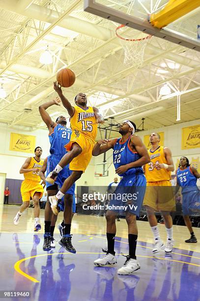 Horace Wormely of the Los Angeles D-Fenders goes up for a shot over Latavious Williams and Mustafa Shakur of the Tulsa 66ers during the D-League game...