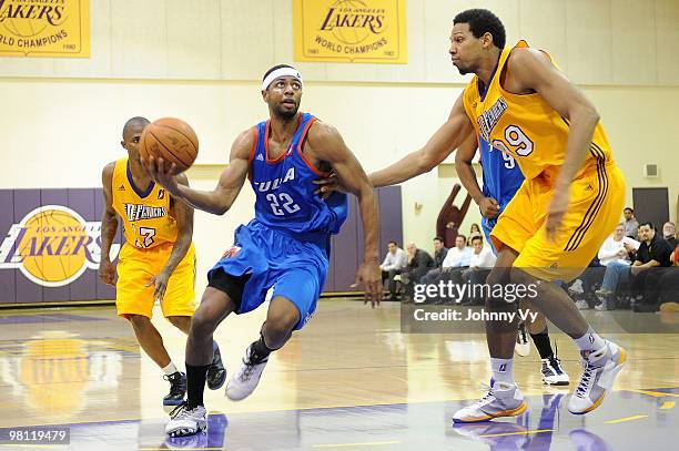 Mustafa Shakur of the Tulsa 66ers drives to the basket past Gabriel Hughes of the Los Angeles D-Fenders during the D-League game on February 10, 2010...