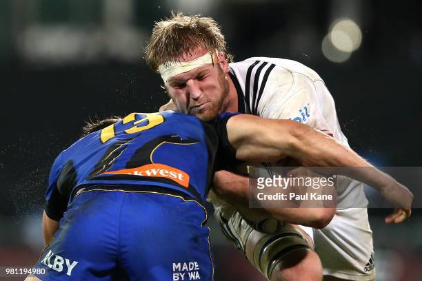 Mitchell Dunshea of the Crusaders is tackled by Brad Lacey of the Force during the World Series Rugby match between the Western Force and the...