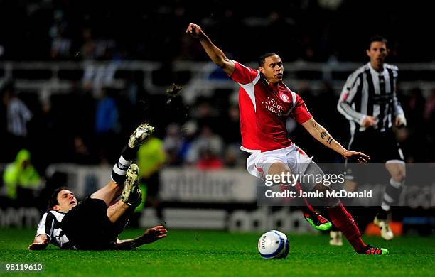 Nathan Tyson of Nottingham Forest is tackled by Fabricio Coloccini of Newcastle United during the Coca-Cola Championship match between Newcastle...