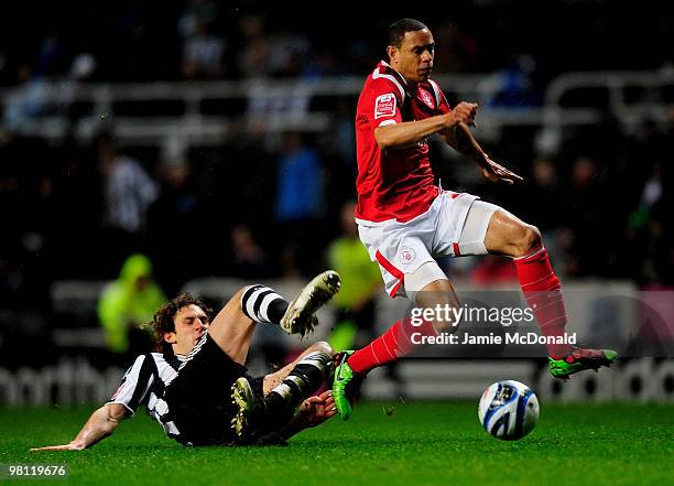 Nathan Tyson of Nottingham Forest is tackled by Fabricio Coloccini of Newcastle United during the Coca-Cola Championship match between Newcastle...