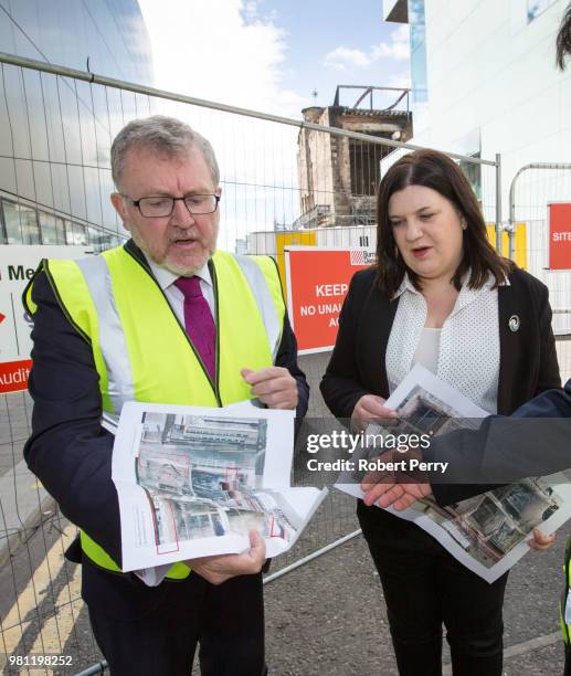 David Mundell, Secretary of State for Scotland inspects aerial photographs of the damage done to the Mackintosh Building at Glasgow School of Art...