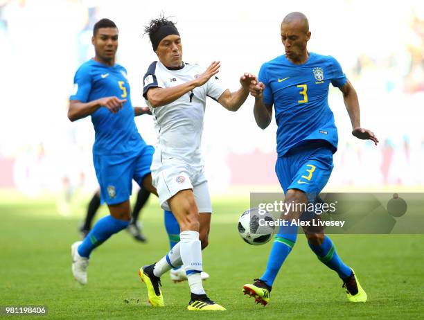 Christian Bolanos of Costa Rica battles for possession with Miranda of Brazil during the 2018 FIFA World Cup Russia group E match between Brazil and...
