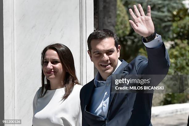 Greek Prime Minister Alexis Tsipras waves as he leave the Presidential Palace in Athens on June 22 after a briefing with the Greek President...