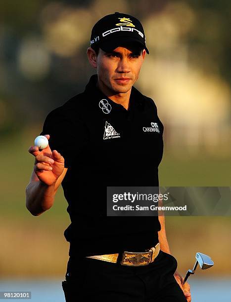 Camilo Villegas of Columbia reacts to a par putt on the 18th hole during the third round of the Honda Classic at PGA National Resort And Spa on March...