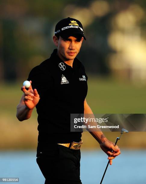 Camilo Villegas of Columbia reacts to a par putt on the 18th hole during the third round of the Honda Classic at PGA National Resort And Spa on March...