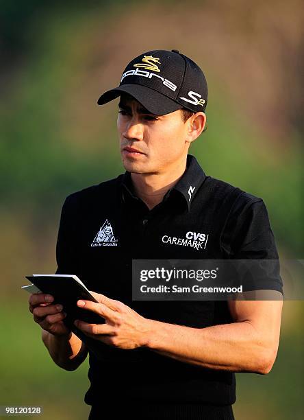 Camilo Villegas of Columbia looks over the yardage on the 16th hole during the third round of the Honda Classic at PGA National Resort And Spa on...