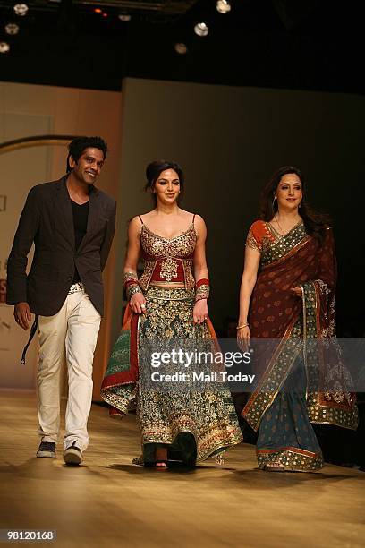 Actress Hema Malini with daughter Esha Deol and designer Rocky S walks the ramp at day three of the Wills Lifestyle India Fashion Week Autumn Winter...