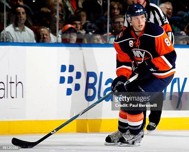 Defenseman Bruno Gervais of the New York Islanders skates up ice during an NHL game against the Calgary Flames at the Nassau Coliseum on March 25,...