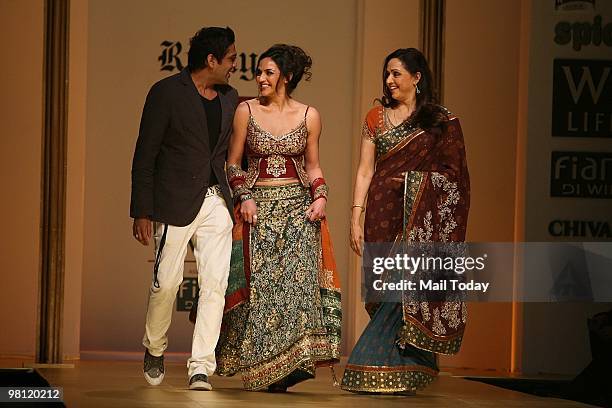 Actress Hema Malini with daughter Esha Deol and designer Rocky S walks the ramp at day three of the Wills Lifestyle India Fashion Week Autumn Winter...