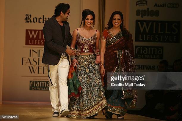 Actress Hema Malini with daughter Esha Deol and designer Rocky S walks the ramp at day three of the Wills Lifestyle India Fashion Week Autumn Winter...