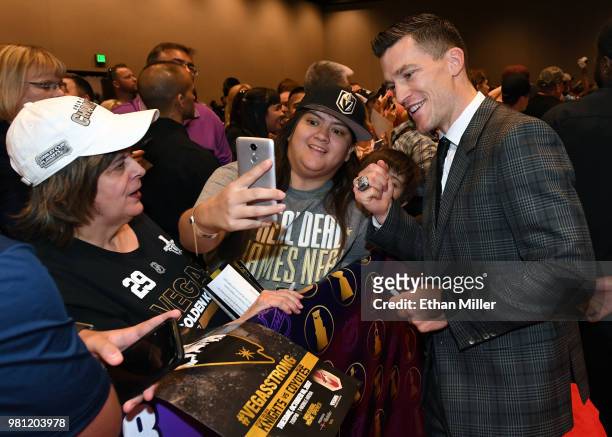 Former NHL player Andrew Ference poses for photos with fans as he arrives at the 2018 NHL Awards presented by Hulu at the Hard Rock Hotel & Casino on...