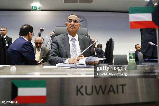 Bakheet Al-Rashidi, Kuwait's oil minister, browses documents ahead of the 174th Organization Of Petroleum Exporting Countries meeting in Vienna,...