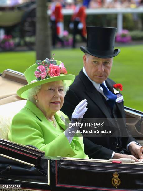 Queen Elizabeth II and David Armstrong-Jones, Earl of Snowdon arrive in the Royal procession on day 4 of Royal Ascot at Ascot Racecourse on June 22,...